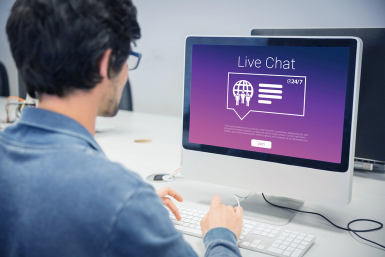 User engaging with 24/7 live chat on computer, showing how Sweeps Casinos create a social hangout experience for music fans