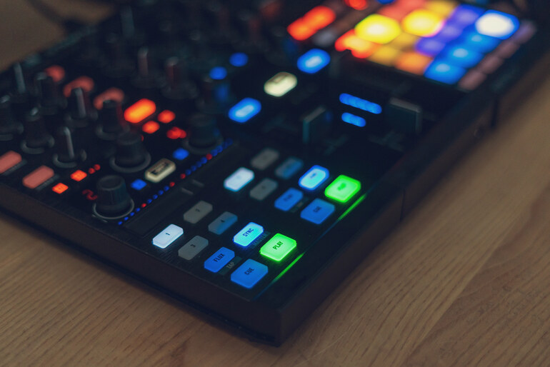 DJ soundboard with colorful pads triggering music effects during a stream
